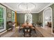 Formal dining room with chandelier, hardwood floors and archway into other rooms at 5545 Cross Gate Ct, Atlanta, GA 30327