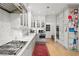 Gourmet kitchen features stainless steel appliances, marble counters, and custom white cabinets at 5545 Cross Gate Ct, Atlanta, GA 30327