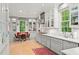 Eat-in kitchen with stainless steel appliances, white cabinetry and a breakfast nook area with views to outside at 5545 Cross Gate Ct, Atlanta, GA 30327