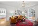 Stylish living room boasts a large rug, modern lighting fixture, and charming decor at 5545 Cross Gate Ct, Atlanta, GA 30327