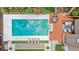 Aerial view of a backyard pool, patio, and lounge area surrounded by green landscaping and trees at 5545 Cross Gate Ct, Atlanta, GA 30327