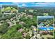 Aerial view of a beautiful home and neighborhood near a golf course and tennis court at 5623 Brendlynn Dr, Suwanee, GA 30024