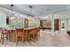 Entertainer's bar with seating, recessed lighting, and a game room with a pool table at 5623 Brendlynn Dr, Suwanee, GA 30024