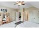 Another view of a relaxing bedroom featuring neutral tones and private ensuite bathroom at 5623 Brendlynn Dr, Suwanee, GA 30024