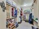 Spacious walk-in closet with custom shelving and ample storage space for an organized wardrobe at 5623 Brendlynn Dr, Suwanee, GA 30024