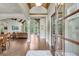 Grand foyer boasts hardwood floors, arched entryways, and natural light flowing into the open living space at 5623 Brendlynn Dr, Suwanee, GA 30024