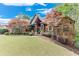 Charming two-story home with beautiful landscaping, a well-manicured lawn, and brick exterior at 5623 Brendlynn Dr, Suwanee, GA 30024