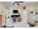 This home office is well-equipped with multiple monitors, a ceiling fan, and a comfortable chair at 5623 Brendlynn Dr, Suwanee, GA 30024