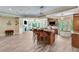 Spacious gourmet kitchen with a large island, modern lighting, and stainless steel appliances at 5623 Brendlynn Dr, Suwanee, GA 30024