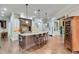 Gourmet kitchen features a large island, custom cabinets, and chef-grade appliances at 5623 Brendlynn Dr, Suwanee, GA 30024