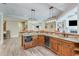 Modern kitchen bar equipped with stainless steel appliances and custom cabinetry at 5623 Brendlynn Dr, Suwanee, GA 30024