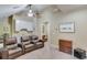 Comfortable living room with vaulted ceiling, theater seating, and mini-bar for entertaining at 5623 Brendlynn Dr, Suwanee, GA 30024