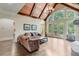 Spacious living room with hardwood flooring, fireplace, and access to the deck at 5623 Brendlynn Dr, Suwanee, GA 30024