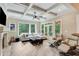 Bright living room boasts coffered ceilings, fireplace, and lots of natural light from large windows at 5623 Brendlynn Dr, Suwanee, GA 30024