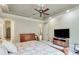 Spacious main bedroom offers an ensuite bathroom, and lots of room for dressers and chairs at 5623 Brendlynn Dr, Suwanee, GA 30024
