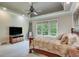 Spacious main bedroom features large windows, a tray ceiling, and neutral color palette at 5623 Brendlynn Dr, Suwanee, GA 30024