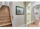 Elegant staircase with hardwood steps, leading to upper levels at 5623 Brendlynn Dr, Suwanee, GA 30024