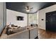Well-lit living room with dark ceiling and modern accents, offering a cozy and inviting space at 1689 Camden Forrest Way, Riverdale, GA 30296