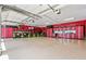 Spacious garage with epoxy floors, storage cabinets, and ample space for multiple vehicles or projects at 2220 Peachtree Rd, Cumming, GA 30041