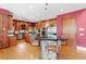 Spacious kitchen with an island, stainless steel appliances, and custom wood cabinets at 2220 Peachtree Rd, Cumming, GA 30041