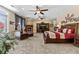 Spacious main bedroom with fireplace and a ceiling fan overlooking a backyard at 2220 Peachtree Rd, Cumming, GA 30041