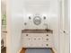 Bathroom featuring a granite countertop, modern lighting, and a vanity with ample storage at 2982 Huntshire Pl, Atlanta, GA 30340