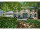 Charming two-story brick home featuring well-maintained landscaping and a welcoming facade at 2982 Huntshire Pl, Atlanta, GA 30340