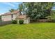 Fenced backyard with lush green grass and mature trees, offering privacy and space at 3984 Oak Glenn Dr, Duluth, GA 30096