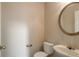 Convenient half bath featuring a modern sink and round mirror at 3984 Oak Glenn Dr, Duluth, GA 30096