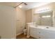 Bathroom featuring double sinks and a shower with white tile at 3984 Oak Glenn Dr, Duluth, GA 30096