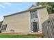 View of the light yellow siding and decorative window above the black front door at 3984 Oak Glenn Dr, Duluth, GA 30096