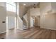 Open living room featuring hardwood floors, a staircase, and lots of natural light at 3984 Oak Glenn Dr, Duluth, GA 30096