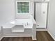 Bright bathroom with a separate tub and glass-enclosed shower, offering a spa-like experience at 6560 Alford Way, Lithonia, GA 30058