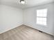 Bright bedroom with neutral carpet, white walls and a window providing ample natural light at 6560 Alford Way, Lithonia, GA 30058