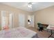 This cozy bedroom includes neutral walls, an ensuite bathroom, and lots of natural light at 3734 Villa Springs Cir, Powder Springs, GA 30127