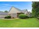 Beautiful home exterior featuring a lush green lawn and manicured shrubbery at 3734 Villa Springs Cir, Powder Springs, GA 30127