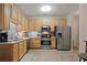 Well-equipped kitchen features stainless steel appliances and ample cabinet space at 3734 Villa Springs Cir, Powder Springs, GA 30127