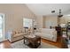 Comfortable living space seamlessly connecting to the kitchen and dining area at 3734 Villa Springs Cir, Powder Springs, GA 30127