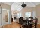 Open-concept living room boasts high ceilings, a fireplace, and an adjacent dining area at 3734 Villa Springs Cir, Powder Springs, GA 30127