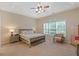 The main bedroom features neutral colors, and a window for natural light and ventilation at 3734 Villa Springs Cir, Powder Springs, GA 30127