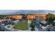 Wide aerial view of The Maxwell, showcasing its layout with parks and mixed-use buildings at 401 Burton Dr, Alpharetta, GA 30009