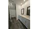 Modern bathroom with double vanity, white cabinets, and a tiled walk-in shower at 401 Burton Dr, Alpharetta, GA 30009