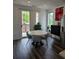 Cozy dining area featuring a round table with grey chairs and sliding doors to the balcony at 401 Burton Dr, Alpharetta, GA 30009