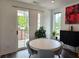 Dining area with hardwood flooring, sliding door access, and modern décor at 401 Burton Dr, Alpharetta, GA 30009