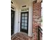 Charming townhouse entryway with a brick landing and classic door at 401 Burton Dr, Alpharetta, GA 30009
