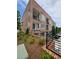 Brick townhouses feature balconies, patios, and manicured lawns at 401 Burton Dr, Alpharetta, GA 30009