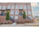 Brick townhomes featuring private entrances and landscaping at 401 Burton Dr, Alpharetta, GA 30009