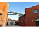 The Maxwell entrance with brick and beige buildings with 'The Maxwell' sign overhead at 401 Burton Dr, Alpharetta, GA 30009