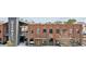 Attractive two-story brick building with 'Rena's' restaurant and retail spaces at The Maxwell at 401 Burton Dr, Alpharetta, GA 30009