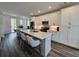 Kitchen features a large island with seating, stainless steel appliances, and modern finishes at 401 Burton Dr, Alpharetta, GA 30009